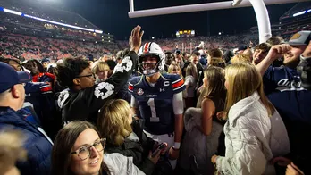 Unranked Auburn upsets CFP-hopeful Texas A&amp;M in 4 OT thriller after game-tying score is dropped