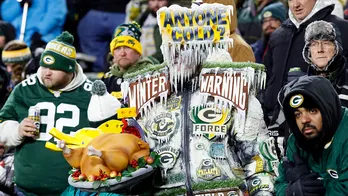 Video of bundled-up Dolphins players warming up at Lambeau Field goes viral after Thanksgiving Day loss